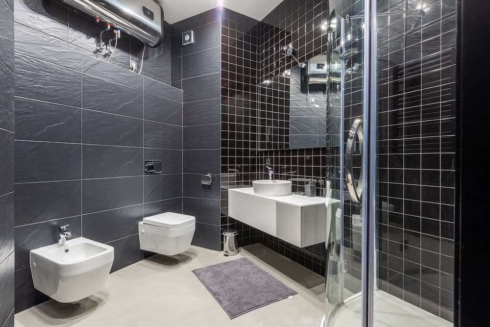 finished bathroom with bidet plumbing